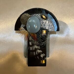Unique Black and Gray Brooch with Feather Accents